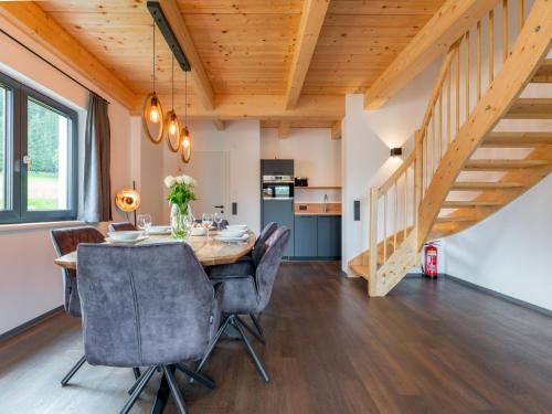 a dining room with a table and chairs at Obermöschach 6 in Obermöschach
