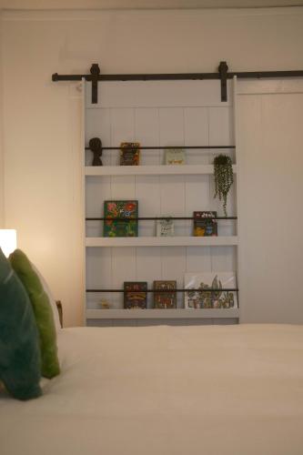 a bedroom with a bed with white shelves at Modern Character Downtown Fargo in Fargo