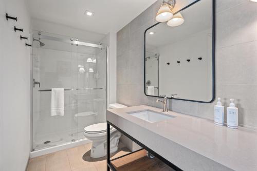 a bathroom with a sink and a toilet and a mirror at Marble Canyon Lodge in Marble Canyon