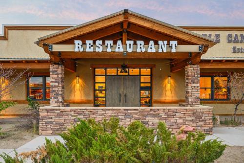 a restaurant with a sign on the front of a building at Marble Canyon Lodge in Marble Canyon
