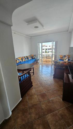 a room with beds and a tiled floor at La cassia in Cabo Negro