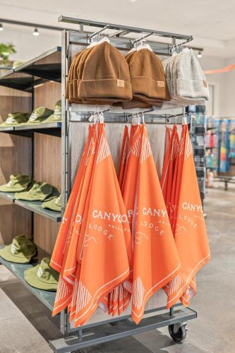 a rack with orange umbrellas and a purse at Marble Canyon Lodge in Marble Canyon