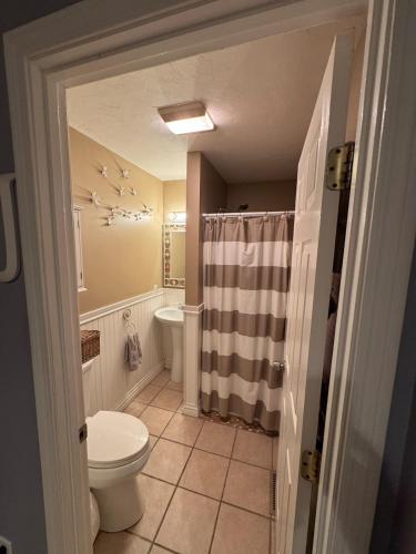 a bathroom with a toilet and a sink at Summer Wind in Hull