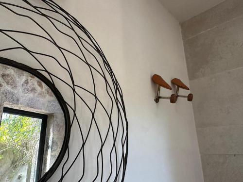 a room with a round mirror and a window at Concept House in Banda
