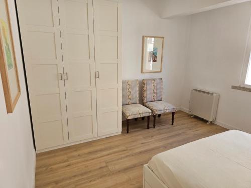 En eller flere senge i et værelse på Apartamento acogedor