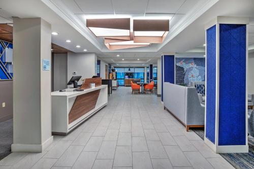 an office lobby with a desk and chairs at Holiday Inn Express Sault Ste Marie by IHG in Sault Ste. Marie