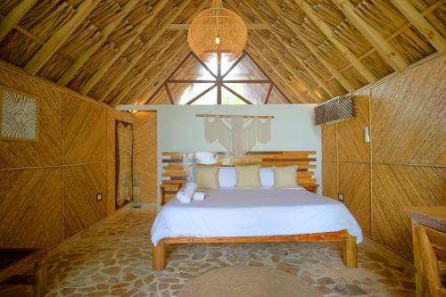 Hotel Isla Mucuraにあるベッド