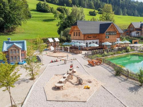 an aerial view of a playground and a building at Chalet near Lake Grundlsee with Sauna in Grundlsee