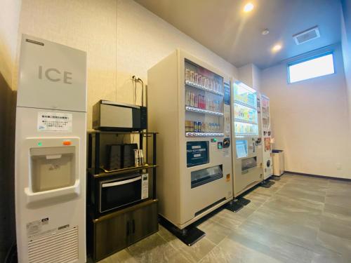 a store with two refrigerators and a ice machine at Hotel Route-Inn Ichihara in Ichihara