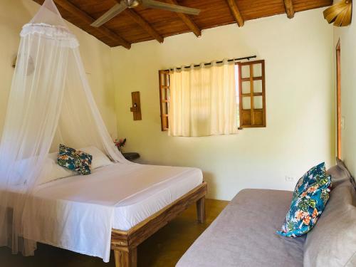 a bedroom with a bed and a window at Kallpa B&B in Palomino