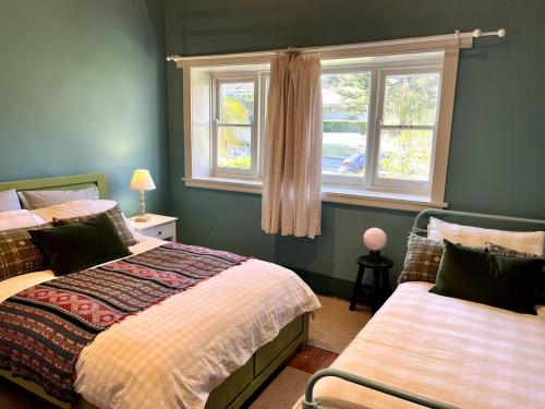 Ένα ή περισσότερα κρεβάτια σε δωμάτιο στο Spacious Beachside Apartment