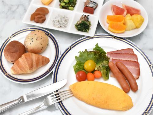 a plate of food with different types of food at Odysis Suites Osaka Airport Hotel in Izumi-Sano