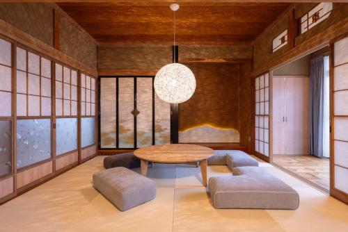 Una cama o camas en una habitación de 町宿Oranchi kisetsu