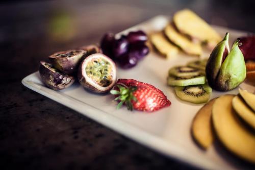 a plate of fruit and vegetables on a table at Carlton George Hotel in Glasgow