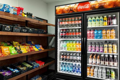a refrigerator filled with lots of different types of drinks at Holiday Inn Louisville East - Hurstbourne by IHG in Louisville