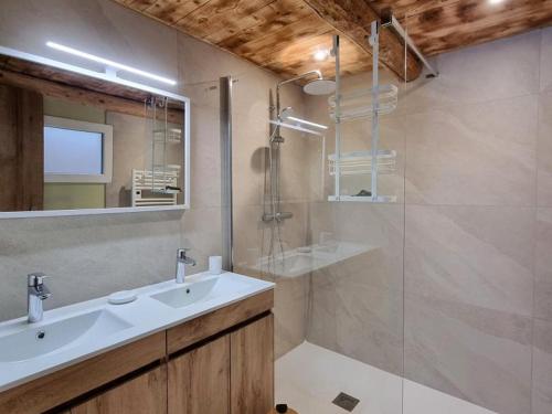 a bathroom with a sink and a shower at Spacieux gîte avec bain nordique et wifi à Usson-en-Forez - FR-1-496-359 in Usson-en-Forez