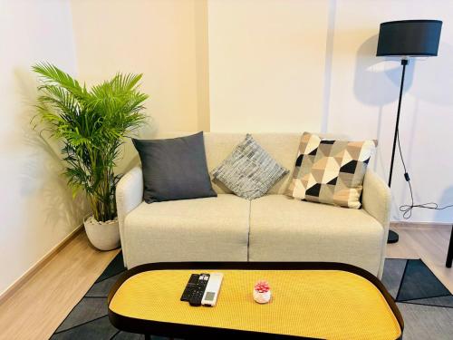 a living room with a couch and a coffee table at Poolside Paradise, Nice pool view in Kathu
