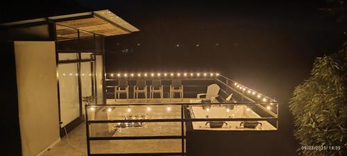 a bathroom with a sink with lights on it at MeNTA GLAMPING in Sasaima
