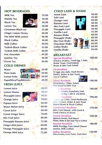 Um cardápio de restaurante com fotos de comida. em GOLDENGARDEN COTTAGES em Hampi