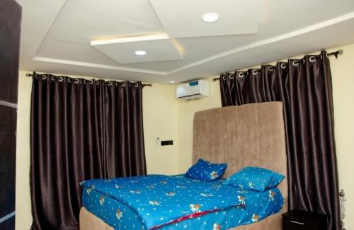 Ένα ή περισσότερα κρεβάτια σε δωμάτιο στο D Best luxury service apartment lodge