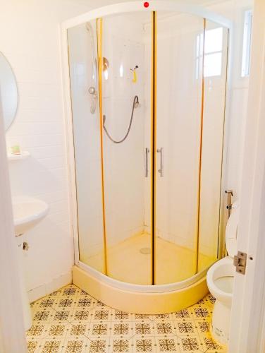 a bathroom with a shower and a toilet at XCLUSIVE-7lAyutthayalX-7อยุธยา in Phra Nakhon Si Ayutthaya