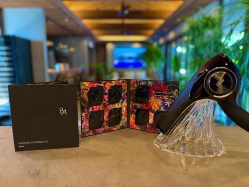 a black hairdryer on top of a table at Sunrise Villa Oarai in Natsumi