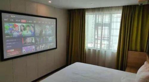 Ένα ή περισσότερα κρεβάτια σε δωμάτιο στο IU Hotel Changsha Railway Station Branch