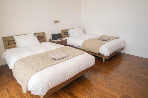 Ένα ή περισσότερα κρεβάτια σε δωμάτιο στο soraniwa hotel and cafe