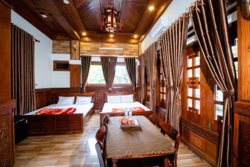 Giường trong phòng chung tại Phố Thiên Đường Homestay