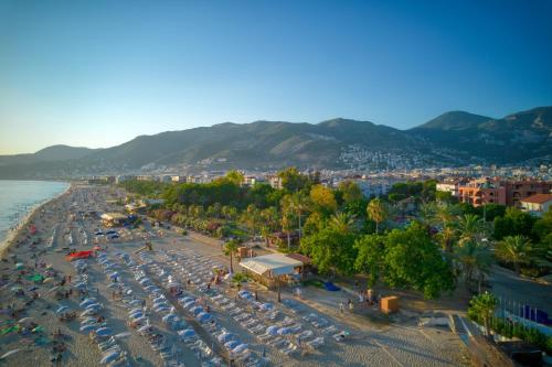 an aerial view of a beach with umbrellas at La Gaia - Adult Only in Alanya