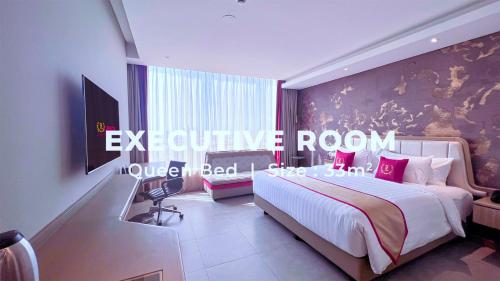 Letto o letti in una camera di Leedon Hotel & Suites Surabaya