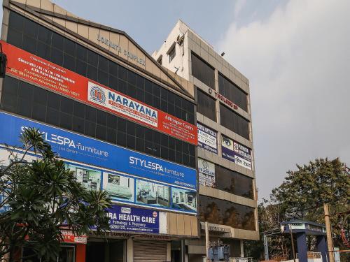 a building with signs on the side of it at Hotel O Lokenath in Jamshedpur