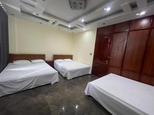 Katil atau katil-katil dalam bilik di Bảo An Hotel- Tuần Châu Hạ Long