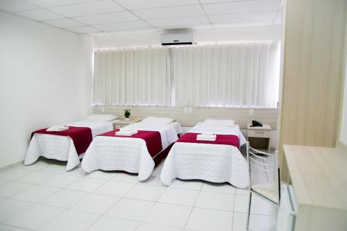 Katil atau katil-katil dalam bilik di Reis Palace Hotel