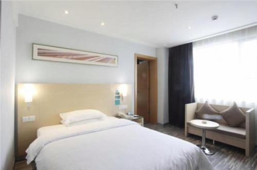 Ένα ή περισσότερα κρεβάτια σε δωμάτιο στο City Comfort Inn Beiliu Bus Terminal