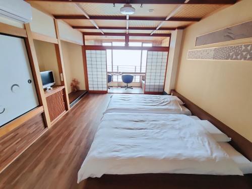 Cama o camas de una habitación en Hokkawa Onsen Hotel