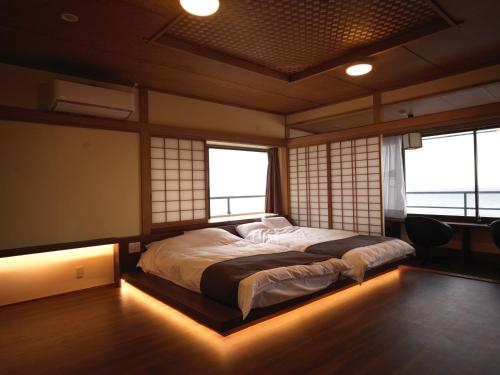 Cama o camas de una habitación en Hokkawa Onsen Hotel