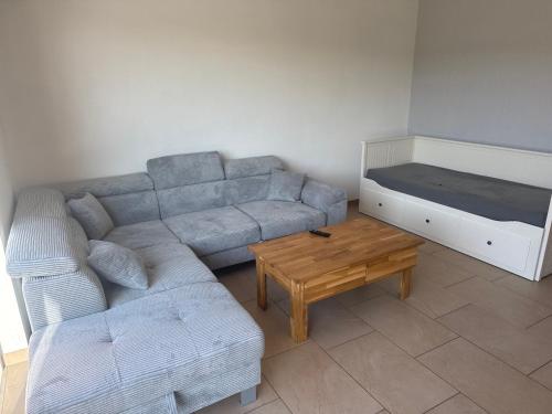 a living room with a couch and a coffee table at Fewo Oster in Ochtrup