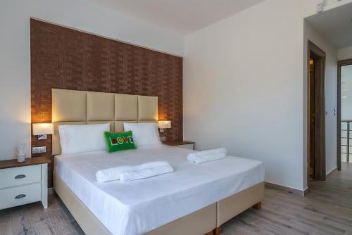 Posteľ alebo postele v izbe v ubytovaní Plakias Seaside Residences