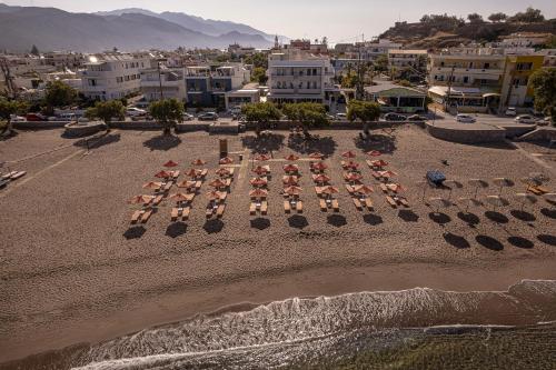 an aerial view of a beach with chairs and umbrellas at Pal Beach in Palaiochóra