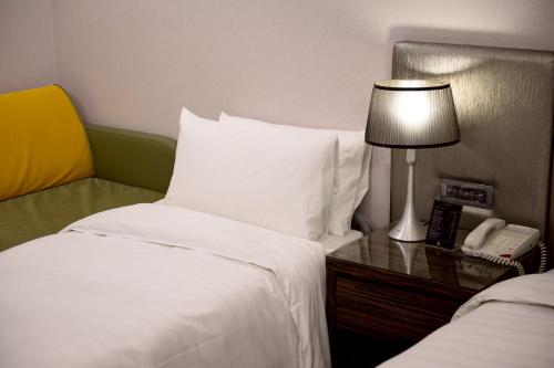 Ein Bett oder Betten in einem Zimmer der Unterkunft Hotel Geight Taipei