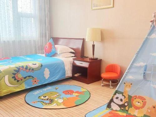 a bedroom with a bed with a dinosaur bedspread at Shaanxi Business Hotel in Shanghai