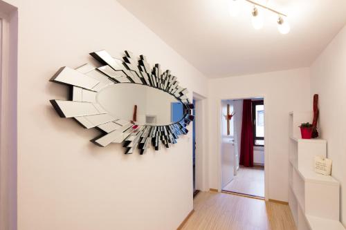 a large mirror on a wall in a room at W & S Executive Apartments - Hallstatt I in Hallstatt