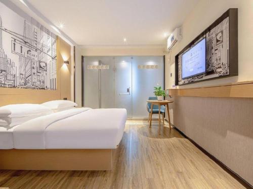 Cama o camas de una habitación en City Comfort Inn Nanning Railway Station Guangxi University