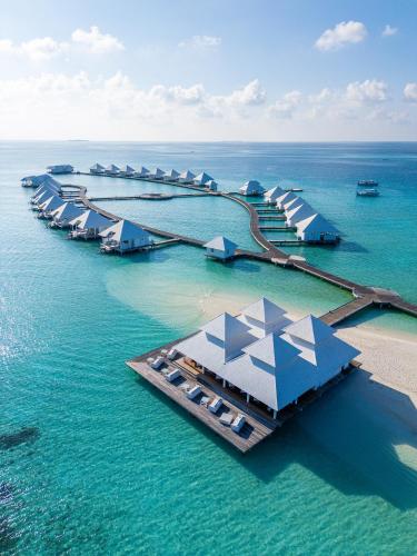 an aerial view of a resort in the water at Diamonds Athuruga Maldives Resort & Spa in Athuruga Island