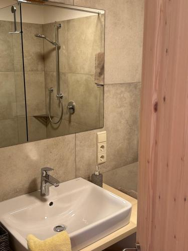 a bathroom with a sink and a shower at Liebharterhof in Valdaora