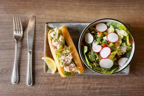 a plate of food with a salad and a sandwich at Four Points by Sheraton Halifax in Halifax