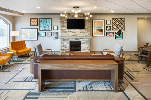 a lobby with a couch and a fireplace at Four Points by Sheraton Halifax in Halifax