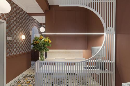 a hallway with a white bench and a mirror at Morus Acropolis Boutique Hotel in Athens