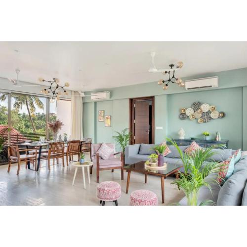 a living room with a couch and a table at Dia Hotels and Homes Nerul Goa - Villas and Apartments in Nerul